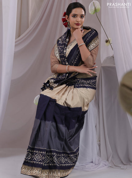 Grey-navy blue pochampally silk saree with allover ikat weaves and Embroidered border