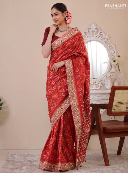 Red Pochampally silk saree with allover ikat weaves and Embroidered border
