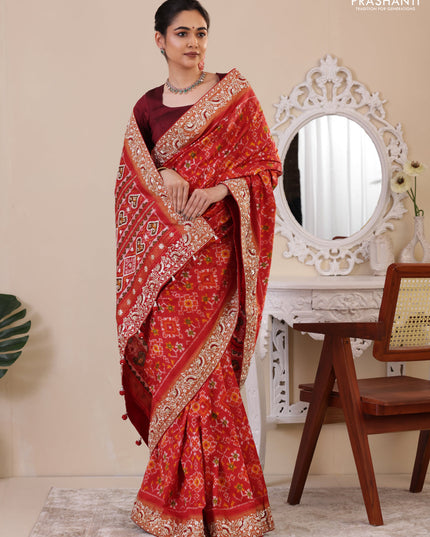 Red Pochampally silk saree with allover ikat weaves and Embroidered border