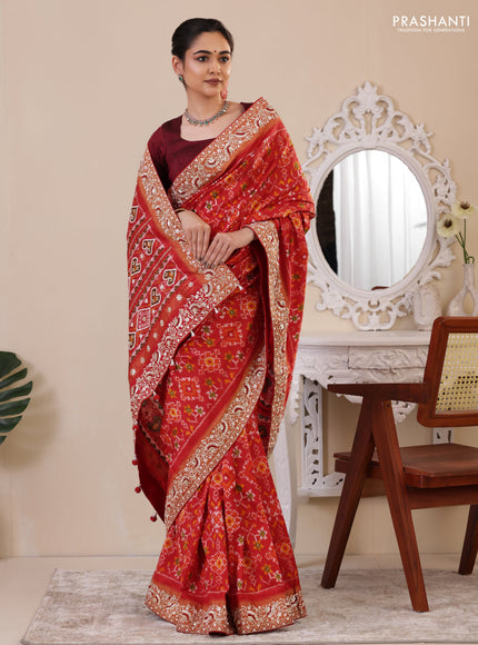 Red Pochampally silk saree with allover ikat weaves and Embroidered border