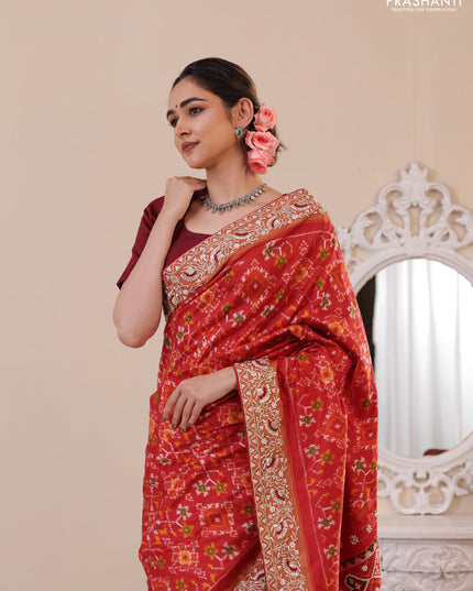 Red Pochampally silk saree with allover ikat weaves and Embroidered border