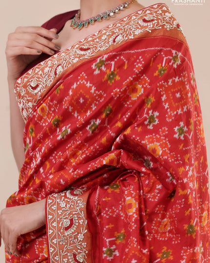 Red Pochampally silk saree with allover ikat weaves and Embroidered border