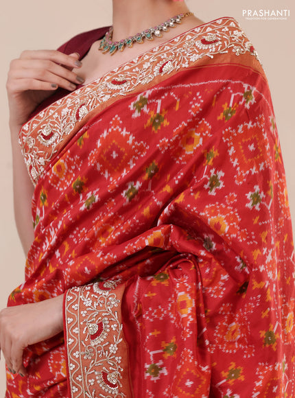 Red Pochampally silk saree with allover ikat weaves and Embroidered border
