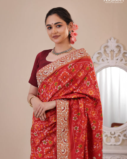 Red Pochampally silk saree with allover ikat weaves and Embroidered border