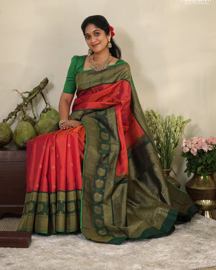 Pinkish orange-Green Pure kanchipuram silk saree with zari woven buttas & long zari woven border