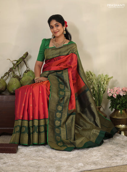 Pinkish orange-Green Pure kanchipuram silk saree with zari woven buttas & long zari woven border
