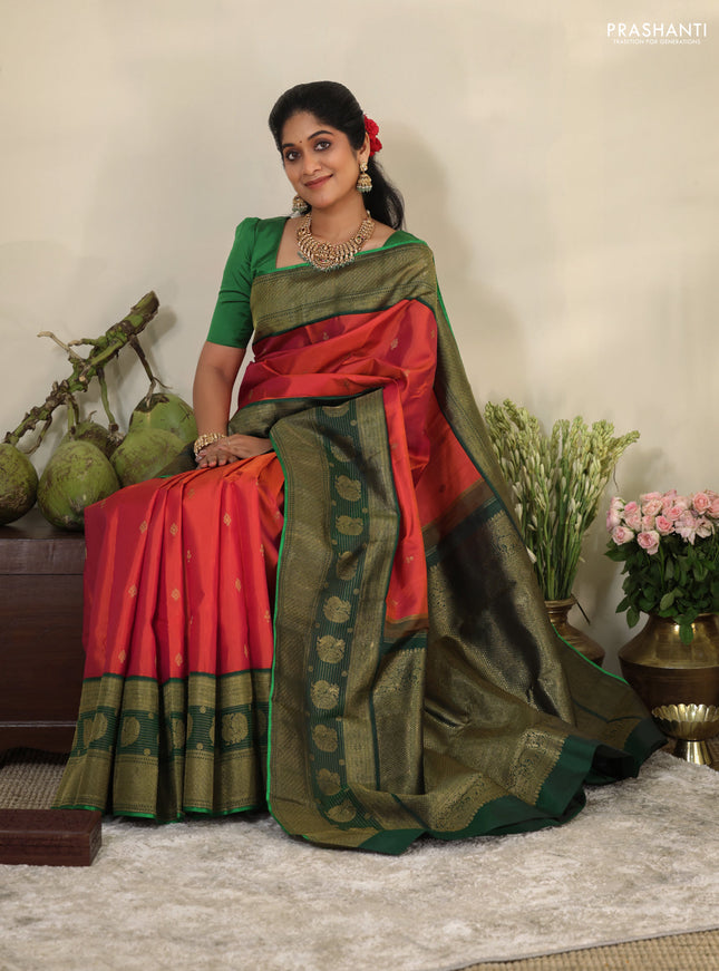 Pinkish orange-Green Pure kanchipuram silk saree with zari woven buttas & long zari woven border