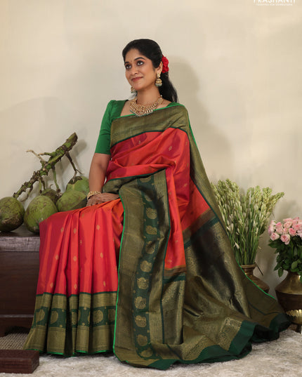 Pinkish orange-Green Pure kanchipuram silk saree with zari woven buttas & long zari woven border