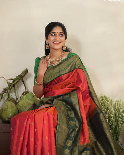 Pinkish orange-Green Pure kanchipuram silk saree with zari woven buttas & long zari woven border