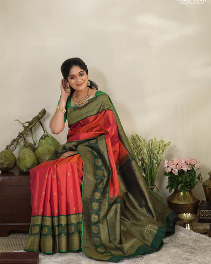 Pinkish orange-Green Pure kanchipuram silk saree with zari woven buttas & long zari woven border