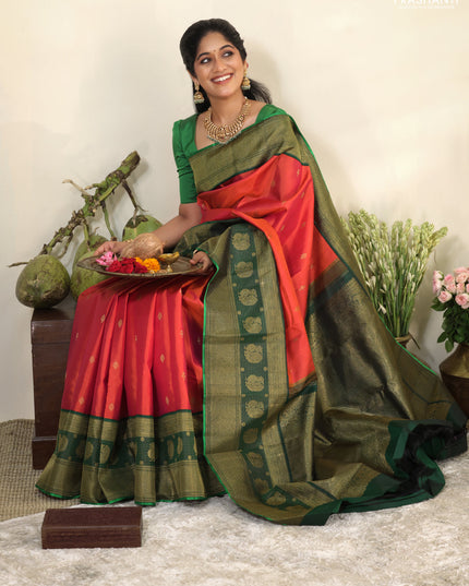 Pinkish orange-Green Pure kanchipuram silk saree with zari woven buttas & long zari woven border