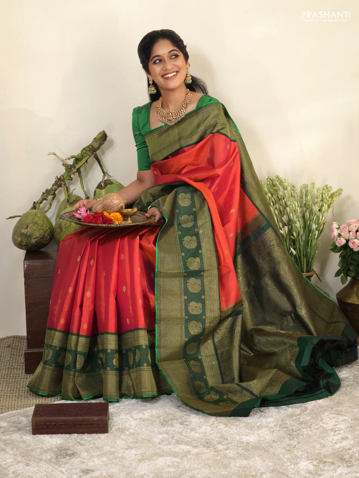 Pinkish orange-Green Pure kanchipuram silk saree with zari woven buttas & long zari woven border