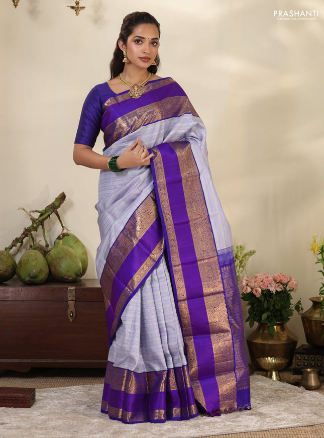 Pastel grey-Violet Pure Kanchipuram silk saree with allover stripes pattern & long zari woven border