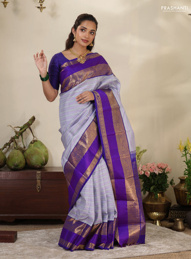 Pastel grey-Violet Pure Kanchipuram silk saree with allover stripes pattern & long zari woven border