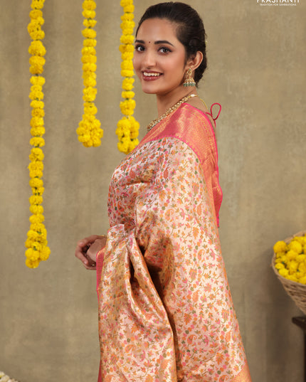 Mild peach-Pink Pure kanchipuram tissue silk saree with allover mina weaves & zari woven border