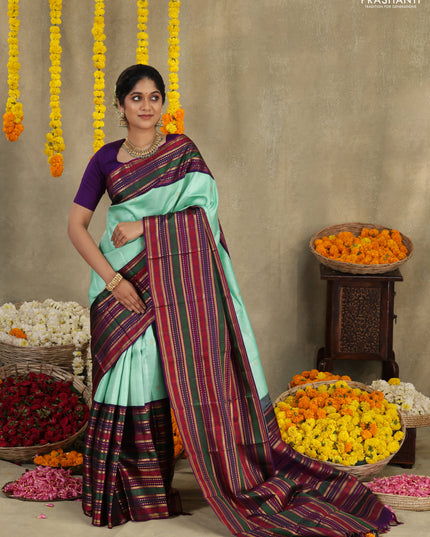 Teal -purple Pure kanchipuram silk saree with allover zari weaves & long zari woven border