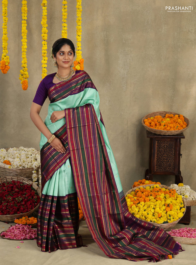 Teal -purple Pure kanchipuram silk saree with allover zari weaves & long zari woven border