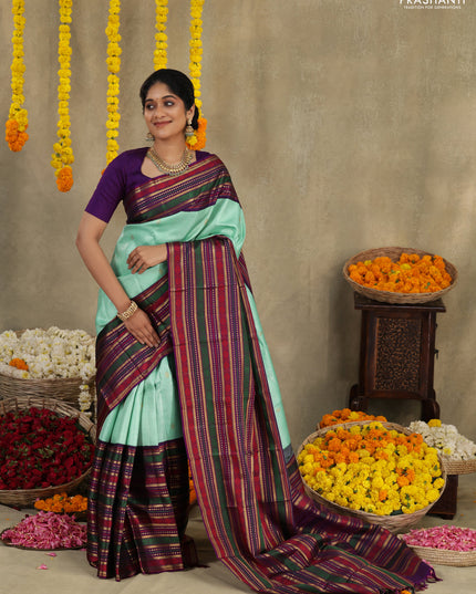 Teal -purple Pure kanchipuram silk saree with allover zari weaves & long zari woven border