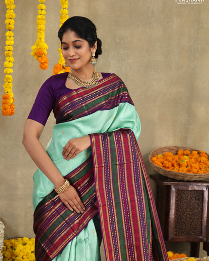 Teal -purple Pure kanchipuram silk saree with allover zari weaves & long zari woven border