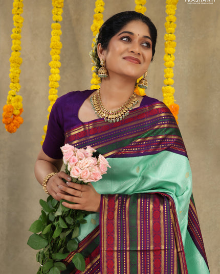 Teal -purple Pure kanchipuram silk saree with allover zari weaves & long zari woven border
