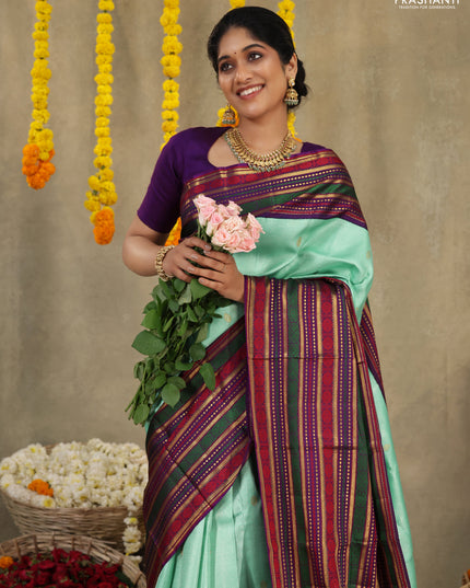 Teal -purple Pure kanchipuram silk saree with allover zari weaves & long zari woven border