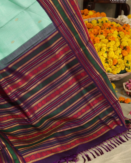 Teal -purple Pure kanchipuram silk saree with allover zari weaves & long zari woven border
