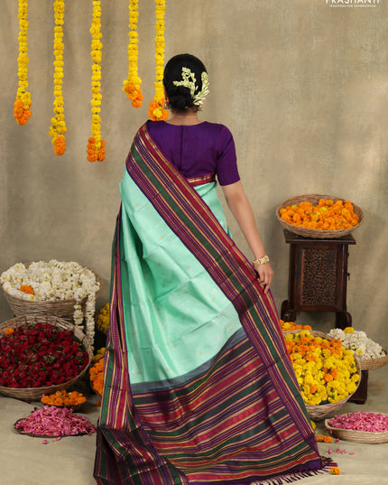 Teal -purple Pure kanchipuram silk saree with allover zari weaves & long zari woven border