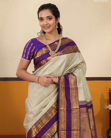 Pista Green-Purple Pure Kanchipuram Silk Saree with Allover zari checks & buttas and Rettapet zari woven border
