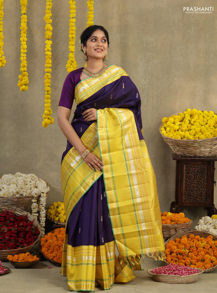 Blue-Yellow Pure Kanchipuram silk saree with zari woven buttas & long zari woven border