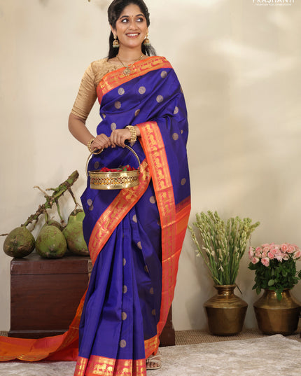 Blue-Dual shade of pinkish orange pure kanchipuram silk saree with zari woven buttas & zari woven border