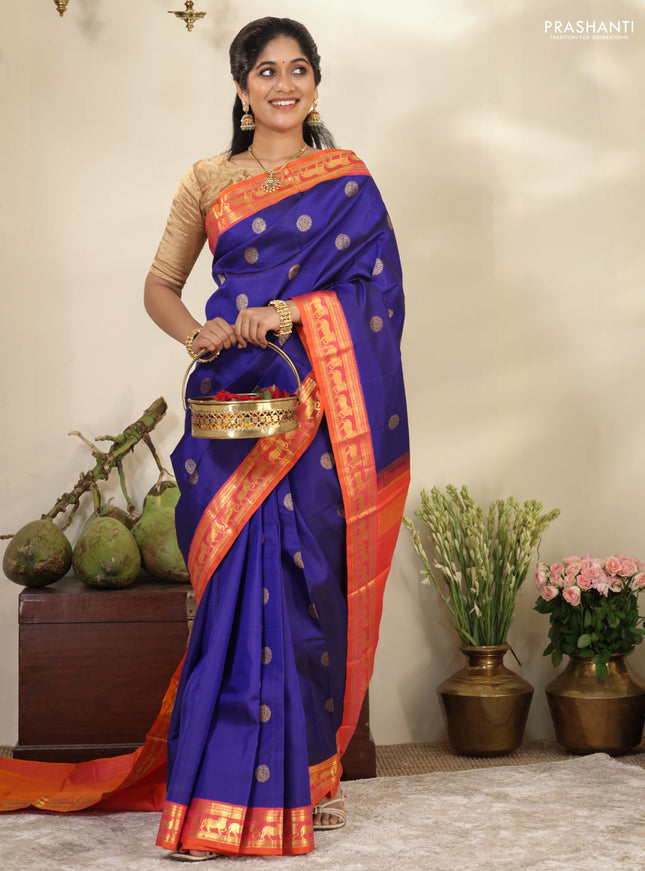 Blue-Dual shade of pinkish orange pure kanchipuram silk saree with zari woven buttas & zari woven border