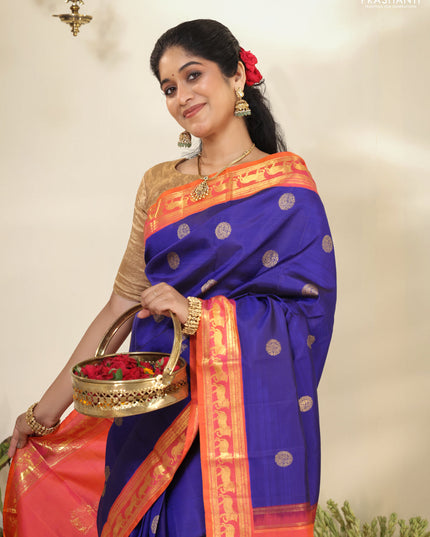 Blue-Dual shade of pinkish orange pure kanchipuram silk saree with zari woven buttas & zari woven border