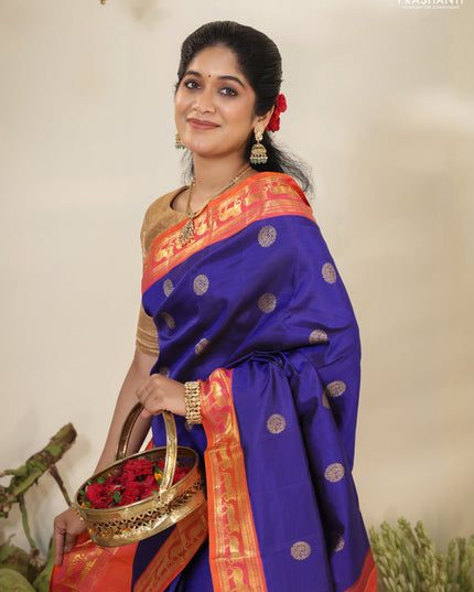 Blue-Dual shade of pinkish orange pure kanchipuram silk saree with zari woven buttas & zari woven border