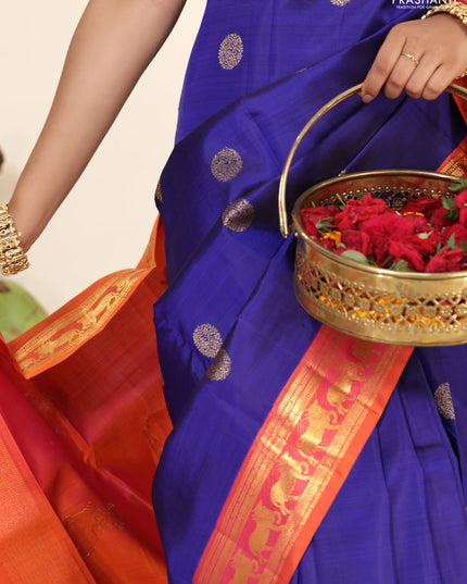 Blue-Dual shade of pinkish orange pure kanchipuram silk saree with zari woven buttas & zari woven border