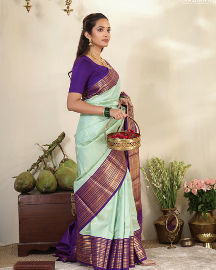 Pastel Green-Purple Pure kanchipuram silk saree with allover zari weaves & buttas and long zari woven border
