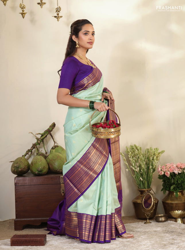 Pastel Green-Purple Pure kanchipuram silk saree with allover zari weaves & buttas and long zari woven border