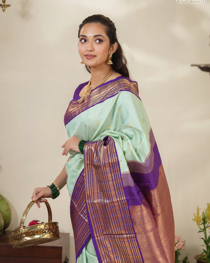 Pastel Green-Purple Pure kanchipuram silk saree with allover zari weaves & buttas and long zari woven border