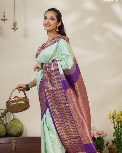 Pastel Green-Purple Pure kanchipuram silk saree with allover zari weaves & buttas and long zari woven border