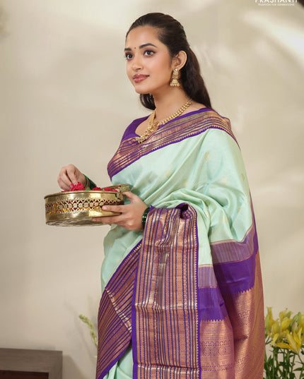 Pastel Green-Purple Pure kanchipuram silk saree with allover zari weaves & buttas and long zari woven border