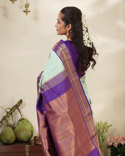 Pastel Green-Purple Pure kanchipuram silk saree with allover zari weaves & buttas and long zari woven border
