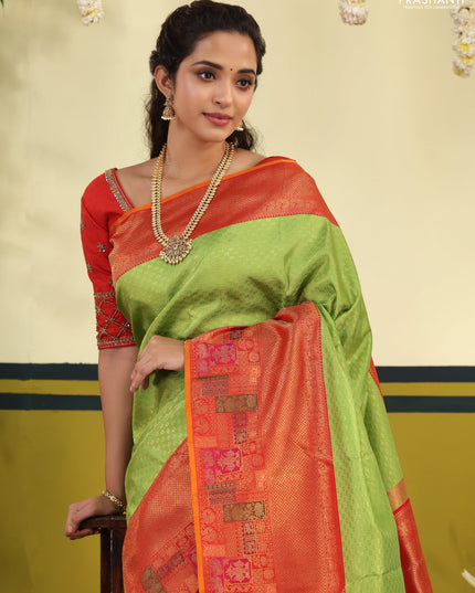 Light Green-Red pure kanchipuram silk saree with allover zari woven brocade weaves & long zari woven border