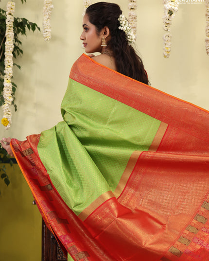 Light Green-Red pure kanchipuram silk saree with allover zari woven brocade weaves & long zari woven border