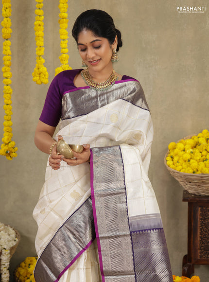 Off white-Purple Pure kanchipuram silk saree with allover zari checks & buttas and zari woven border