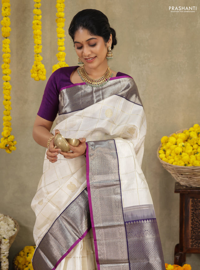 Off white-Purple Pure kanchipuram silk saree with allover zari checks & buttas and zari woven border