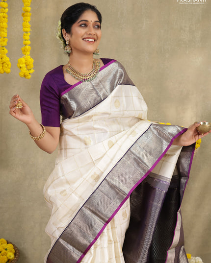 Off white-Purple Pure kanchipuram silk saree with allover zari checks & buttas and zari woven border
