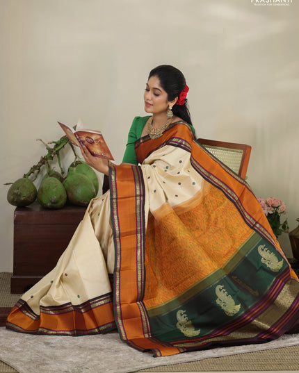 Cream-Deep jamun Pure kanchipuram silk saree with thread woven buttas & zari woven border