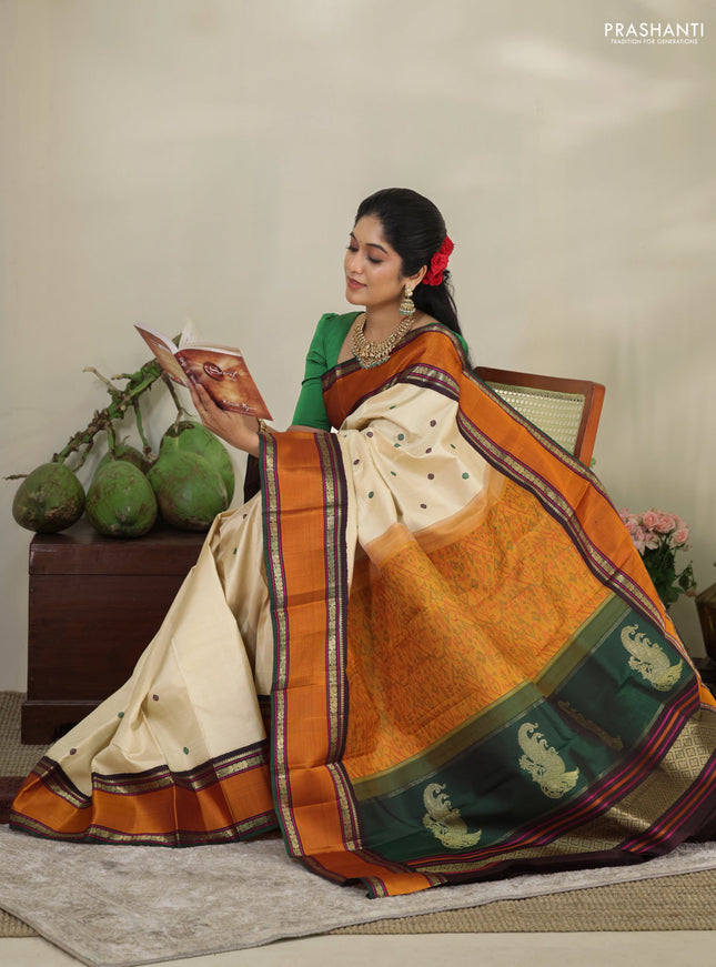 Cream-Deep jamun Pure kanchipuram silk saree with thread woven buttas & zari woven border
