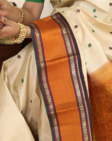 Cream-Deep jamun Pure kanchipuram silk saree with thread woven buttas & zari woven border