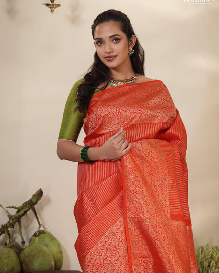 Orange Pure kanchipuram silk saree with allover zari woven brocade weaves & zari woven border