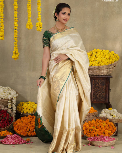 Cream-Green Pure kanchipuram silk saree with silver & gold zari woven stripes pattern and long zari woven border